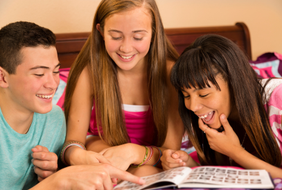  Students looking at yearbook